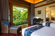Twin bedroom view to lush tropical garden
